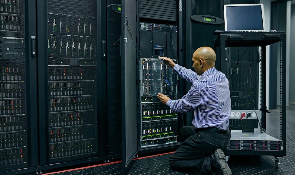 technician checking server racks